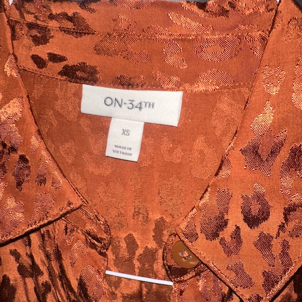 Printed satin jumpsuit. burnt orange color very elegant